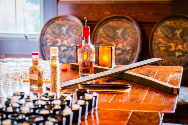 A portion of a barrel and a seared french oak stave used in the barrels for flavor.